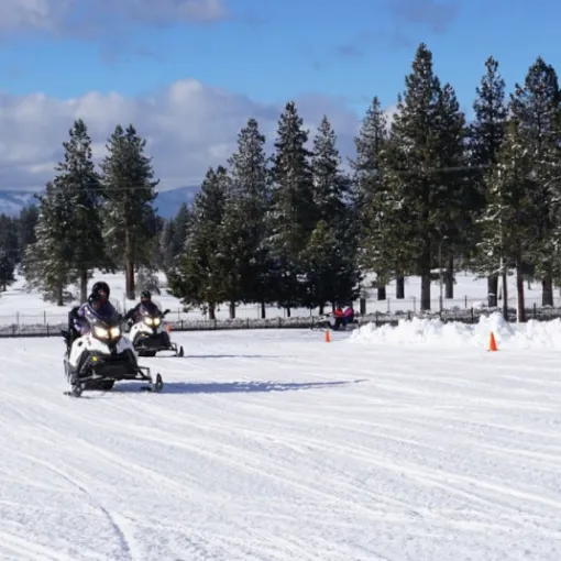 Person driving a Snowmobile Rental