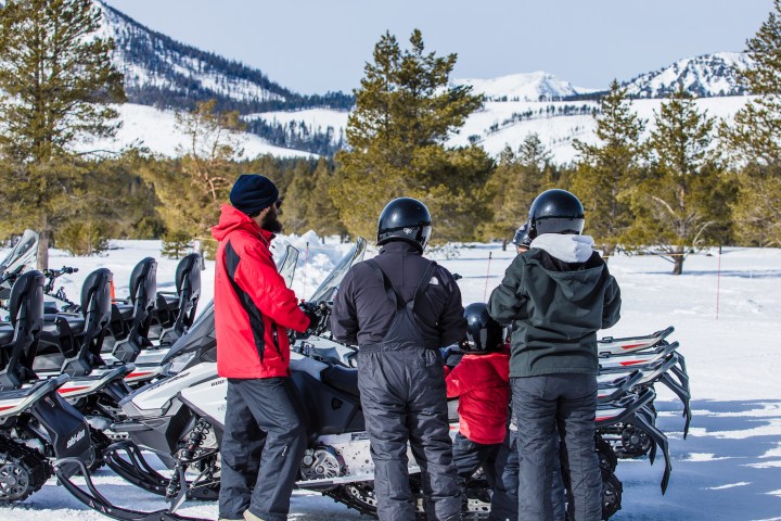 a group of people that are standing in the snow