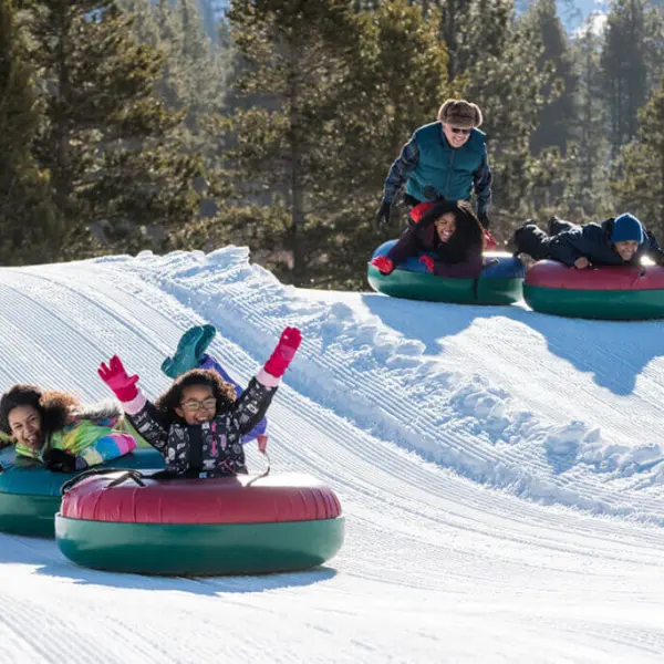 a couple of people that are sitting in the snow