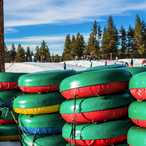 a group of colorful vases sitting on top of a snow covered field