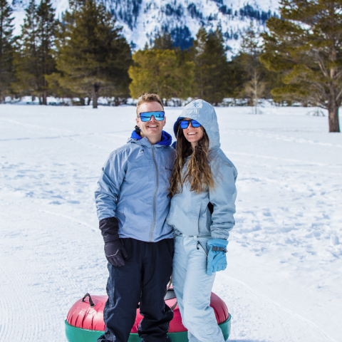 a young child standing on a snow covered slope