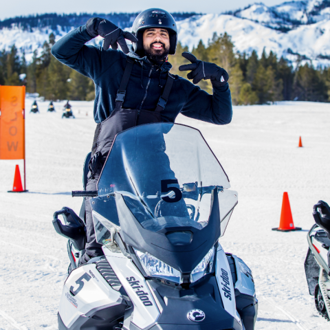 a man that is standing in the snow