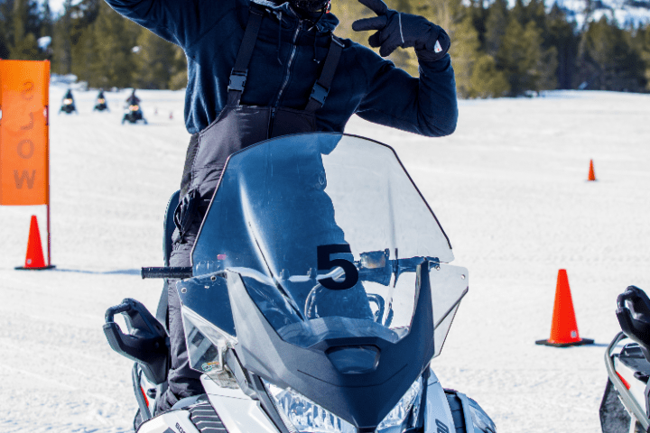 a man that is standing in the snow