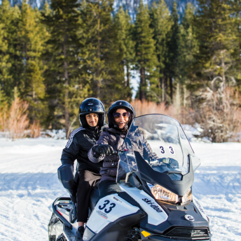 a man riding a motorcycle in the snow