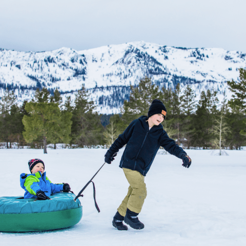 a person riding skis down a snow covered slope