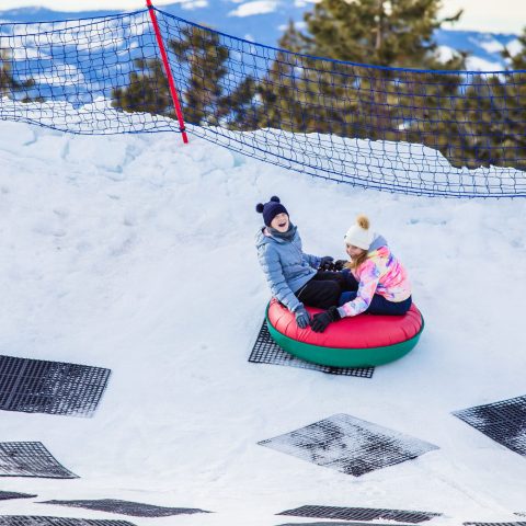 a person skiing down a snow covered slope