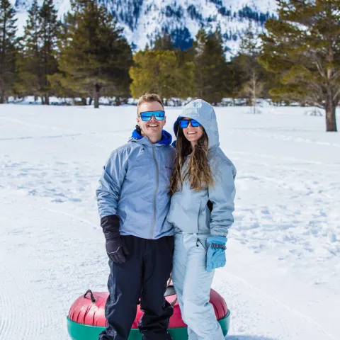 a person standing on a snow covered slope